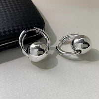 Sleek Round Ball Ear Clips In A Cool Western-style Design