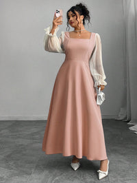 The Woman Is Wearing A Black Mesh-spliced Dress With Bubble Sleeves