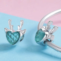 Elk inlaid heart-shaped blue zircon pendant