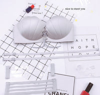 A one-piece seamless bra set with back pull shell for a variety of wear
