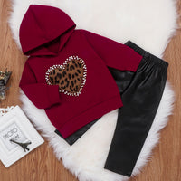 Two-piece hooded sweater and leather pants