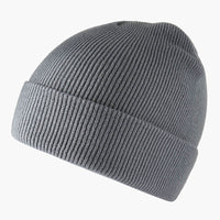 The new knitted woolen hat is thick and warm in solid color