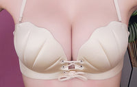 A one-piece seamless bra set with back pull shell for a variety of wear