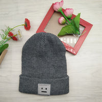 Smiley lady in knitted hat