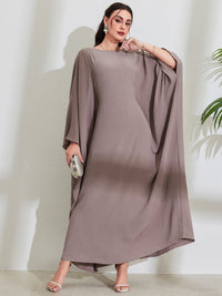Long Dress With Tie Details Batwing Sleeves And A Round Necklinestylish And Elegant