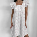 White Sleeveless Dress With Heart Print And Ruffle Trim