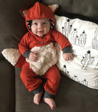 Cartoon fox in a long-sleeved onesie
