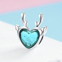 Elk inlaid heart-shaped blue zircon pendant