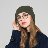 The new knitted woolen hat is thick and warm in solid color