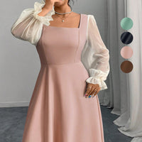 The Woman Is Wearing A Black Mesh-spliced Dress With Bubble Sleeves