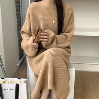 A Knee-length Knitted Sweater Dress Creates A Refined And Elegant Look For The Modern Woman