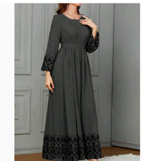 Ethnic-style Printed Wrap Dress Featuring A Cinched Waist Belt And A Flared, Long Skirt
