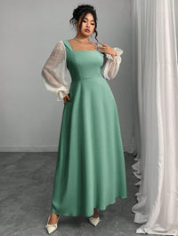 The Woman Is Wearing A Black Mesh-spliced Dress With Bubble Sleeves