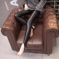 Leggings stepping on women's leather pants