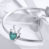 Elk inlaid heart-shaped blue zircon pendant