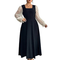 The Woman Is Wearing A Black Mesh-spliced Dress With Bubble Sleeves
