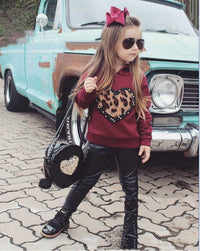 Two-piece hooded sweater and leather pants