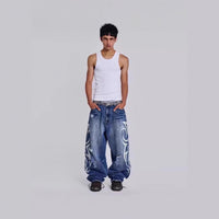 Womens Distressed Relaxed-Fit Denim Jeans With A Bold Totem Print And Extra-Wide Legs