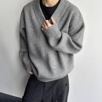 Layered Look With A Relaxed Knit Cardigan Over A Base Top