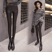 Leggings stepping on women's leather pants