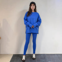 Casual Relaxed Fit Long Sleeve Crew Neck Top With Side Slits Paired With Matching Sweatpants