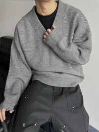 Layered Look With A Relaxed Knit Cardigan Over A Base Top