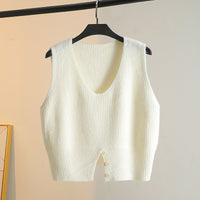 Layering A Sweater Over A Waistcoat And Wearing A Slit V neck Knitted Vest