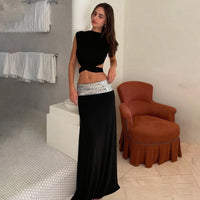 And Elegant Backless Top Paired With A Patchwork Maxi Skirt