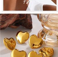 European And American Minimalist Glossy Heart-shaped Stainless Steel Earrings For Women. Light Luxury Minimalist Style. Exaggerated Heart-shaped Earrings. Versatile Accessories.