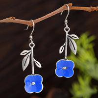Elegant Deep-blue Stud Earrings With Delicate Floral Accents
