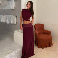 And Elegant Backless Top Paired With A Patchwork Maxi Skirt