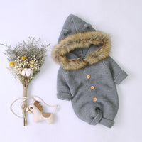 Knitted jumpsuit with fur collar