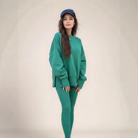 Casual Relaxed Fit Long Sleeve Crew Neck Top With Side Slits Paired With Matching Sweatpants