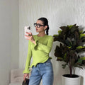 Crew-neck T-shirt With A Solid Color And An Asymmetrical Ruffled Hem