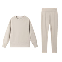 Casual Relaxed Fit Long Sleeve Crew Neck Top With Side Slits Paired With Matching Sweatpants