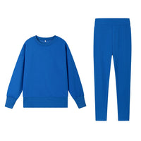 Casual Relaxed Fit Long Sleeve Crew Neck Top With Side Slits Paired With Matching Sweatpants