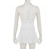 A Sleek, Figure-hugging Halter Dress With A Seamless Cutout Design Delivers An Effortlessly Cool And Edgy Look