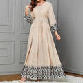 Ethnic-style Printed Wrap Dress Featuring A Cinched Waist Belt And A Flared, Long Skirt