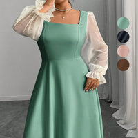 The Woman Is Wearing A Black Mesh-spliced Dress With Bubble Sleeves