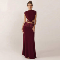And Elegant Backless Top Paired With A Patchwork Maxi Skirt